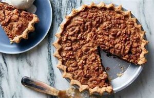 Walnut pie, similar to pecan pie, is a sweet dessert made with walnuts, sugar, and other ingredients.