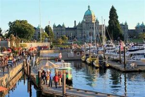 Take a ferry to Vancouver Island and explore the charming city of Victoria with its British colonial architecture and beautiful gardens.