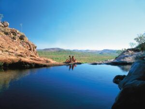 A natural infinity pool with a waterfall and panoramic views of the southern region of Kakadu.