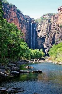 A stunning waterfall surrounded by towering cliffs, accessible during the dry season for swimming and hiking.Picture of the Jim Jim Falls Kakadu National Park Australia.