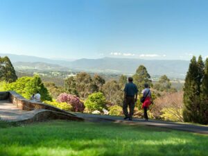 The Dandenong Ranges are a lush mountain range near Melbourne, offering a tranquil escape into nature with towering forests, fern gullies, and cascading waterfalls. It is recommended for weekend getaway destinations in Australia.
