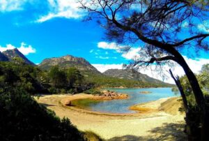 Honeymoon Bay in Freycinet National Park, Tasmania, Australia, is a secluded and romantic beach destination perfect for couples seeking a peaceful retreat.