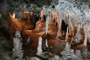 Imperial Cave is known for its impressive formations, including the Queen's Canopy and the Alabaster Column.