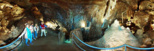 The Temple of Baal Cave is a majestic underground chamber with towering formations and intricate calcite crystals.
