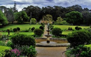 Stroll through the meticulously manicured gardens and lush lawns at the Port Arthur Historic Site in Tasmania, Australia, a tranquil oasis steeped in history.