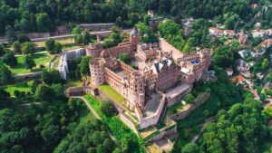 Perched on a hill overlooking the town, Heidelberg Castle is a romantic ruin with stunning views of the Neckar River valley. Heidelberg Castle is very old and It is one of the historical sites in Germany for tourists.