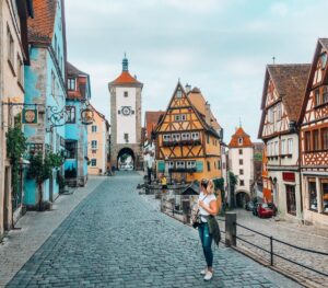 The Romantic Road in Bavaria and Baden-Württemberg features charming towns, castles, and picturesque landscapes, showcasing Germany's history and culture, making it a must-visit historical site.