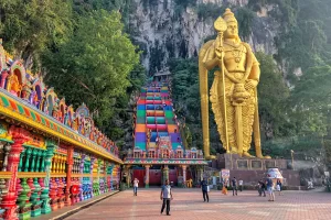 Located just outside Kuala Lumpur, the Batu Caves are a series of limestone caves and Hindu shrines. Visitors can climb the 272 steps to reach the main cave, marvel at the giant golden statue of Lord Murugan, and explore the colorful temples inside the caves.