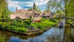 A picturesque village known as the "Venice of the North," with thatched-roof houses, peaceful canals, and charming bridges.