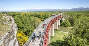 A historic railway line turned cycling and walking trail, the Otago Central Rail Trail winds through the scenic landscapes of Central Otago, showcasing the region's gold mining history.