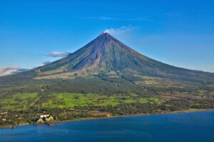 Known for its perfect cone shape, Mayon Volcano is one of the most active volcanoes in the Philippines and offers breathtaking views of the surrounding landscape.