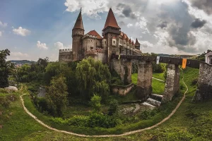 Also known as Hunyadi Castle, this Gothic-Renaissance castle is located in Hunedoara. It is one of the largest castles in Europe and has a rich history connected to the Hunyadi family. The castle features impressive towers, bastions, and a magnificent Knight's Hall.