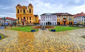 Timișoara is known as the city of flowers and parks, and its Union Square is one of the most beautiful squares in Romania. It features Baroque buildings, the Roman Catholic Cathedral, and the Serbian Orthodox Cathedral, reflecting the city's rich cultural and historical heritage.