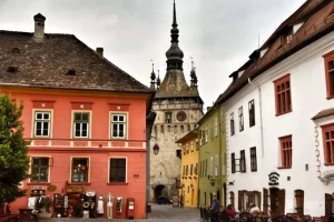 Sighisoara is a well-preserved medieval town in the heart of Transylvania and is the birthplace of Vlad the Impaler. The town's historic center is a UNESCO World Heritage Site, known for its colorful houses, cobbled streets, and the iconic Clock Tower.