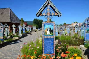 Located in Săpânța, this unique cemetery is famous for its colorful tombstones with naïve paintings and poetic epitaphs that describe the deceased in a humorous manner. It reflects the local belief that death should be a celebration of life.