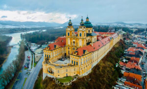 Perched on a rocky outcrop overlooking the Danube River, this Benedictine abbey is renowned for its opulent Baroque architecture, extensive library, and beautiful frescoes.