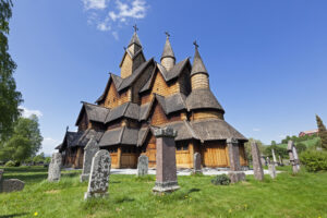 Heddal Stave Church, the largest stave church in Norway, was constructed in the early 13th century. It is famous for its impressive size, ornate carvings, and the combination of pagan and Christian symbols found within.