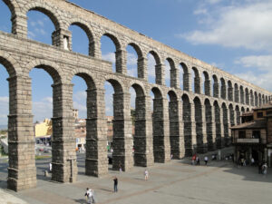 The Roman Aqueduct of Segovia is an impressive ancient structure that once supplied water to the city, showcasing Roman engineering prowess.