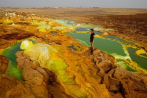 One of the hottest places on Earth, this otherworldly landscape features colorful sulfur springs, salt flats, and active volcanoes, attracting adventurous travelers.