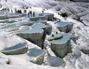 Famous for its thermal mineral waters and white travertine terraces, Pamukkale is a UNESCO World Heritage site. Visitors can bathe in the warm, turquoise pools and explore the ancient ruins of Hierapolis nearby.Pamukkale, is one of the most beautiful places for visitors, in Turkey.