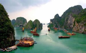 Known for its emerald waters and thousands of limestone islands topped with rainforests, Halong Bay is a UNESCO World Heritage Site. Visitors can take boat cruises, kayak through the caves, and enjoy beautiful places with stunning views of the unique rock formations in Vietnam.